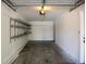 Spacious garage with shelving for storage and ample room for vehicles at 1652 Egret Way, Superior, CO 80027