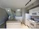 Bright kitchen with white cabinets, modern appliances, and a convenient center island, offering functionality and style at 1652 Egret Way, Superior, CO 80027