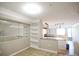 Open-concept living space featuring built-in shelves and seamless flow to the kitchen, perfect for entertaining and relaxation at 1652 Egret Way, Superior, CO 80027