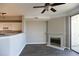 Cozy living area showcases fireplace and opens to kitchen with breakfast bar at 1652 Egret Way, Superior, CO 80027