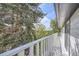Balcony overlooking green trees and blue skies, creating a relaxing outdoor space at 7792 Garrison Ct, Arvada, CO 80005