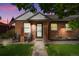 Charming brick home with welcoming front porch and landscaping at 785 S Decatur St, Denver, CO 80219