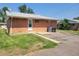 Cozy backyard with brick exterior, grassy area, and convenient parking space at 117 Valentine Ln, Longmont, CO 80501