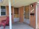 Inviting front porch with space for seating and covered entrance with brick pillar at 117 Valentine Ln, Longmont, CO 80501