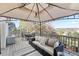 Inviting deck with comfortable seating, a dining set, and scenic views, perfect for relaxation and entertaining at 17067 Motsenbocker Way, Parker, CO 80134