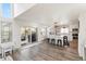 Open concept kitchen with island seating area flows to patio, with stainless appliances and modern lighting at 17067 Motsenbocker Way, Parker, CO 80134