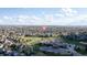 Aerial view showcasing a residential area near a school and park, emphasizing community amenities at 17067 Motsenbocker Way, Parker, CO 80134