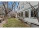 Backyard features a healthy, grassy lawn and landscaping along the home's foundation at 6657 Drew Ranch Ln, Boulder, CO 80301