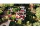Stunning aerial view of an estate with a terracotta roof, lush landscaping, and ample parking at 3 Carriage Brook Rd, Cherry Hills Village, CO 80121
