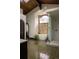 Luxurious bathroom features a soaking tub, glass-enclosed shower, decorative chandelier, and unique tile flooring at 3 Carriage Brook Rd, Cherry Hills Village, CO 80121