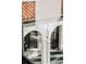 Charming courtyard with white stucco walls, arched openings, and stylish tile flooring at 3 Carriage Brook Rd, Cherry Hills Village, CO 80121