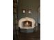 Charming fireplace with brick surround and hearth creates a cozy ambiance at 3 Carriage Brook Rd, Cherry Hills Village, CO 80121