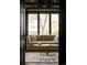 Sunlit living room with plush seating and view of mature trees at 3 Carriage Brook Rd, Cherry Hills Village, CO 80121