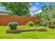 Landscaped backyard with a wooden fence and garden bed at 3049 S Williams St, Denver, CO 80210