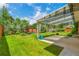 Lush backyard with a covered patio, manicured lawn, and beautiful landscaping at 3049 S Williams St, Denver, CO 80210
