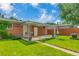 A covered patio in a well-maintained backyard with a lush lawn and mature trees at 3049 S Williams St, Denver, CO 80210