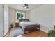 Bedroom with hardwood floors, area rug, a ceiling fan and natural light at 3049 S Williams St, Denver, CO 80210