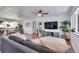 Open floor plan with hardwood floors seamlessly connecting the living and dining areas at 3049 S Williams St, Denver, CO 80210
