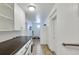 Practical mud room with white cabinets, counter space, and easy access at 3049 S Williams St, Denver, CO 80210