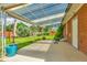 Covered patio area overlooking the landscaped backyard with a lawn and garden at 3049 S Williams St, Denver, CO 80210