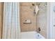 Shower features a tile surround, sleek fixtures and a tub at 3049 S Williams St, Denver, CO 80210