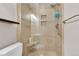 Tiled shower with glass doors, a built-in seat, showerhead and sleek fixtures at 3049 S Williams St, Denver, CO 80210