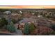 Expansive property with an updated home, lush landscaping, and sweeping sunset views at 1159 Buffalo Ridge Rd, Castle Pines, CO 80108