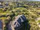 An aerial view of a luxury home with a private lot in a peaceful neighborhood at 1159 Buffalo Ridge Rd, Castle Pines, CO 80108