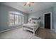 Serene bedroom featuring a vaulted ceiling and large window at 1159 Buffalo Ridge Rd, Castle Pines, CO 80108