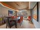 Stylish dining room featuring a unique ceiling design, modern chandelier, and large window with natural light at 1159 Buffalo Ridge Rd, Castle Pines, CO 80108
