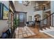 Grand foyer showcasing hardwood floors, a staircase, and an open floor plan leading to the dining and living areas at 1159 Buffalo Ridge Rd, Castle Pines, CO 80108