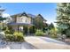 Stunning home with a circular drive and beautiful landscaping at 1159 Buffalo Ridge Rd, Castle Pines, CO 80108