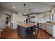 Spacious gourmet kitchen with custom cabinets, granite countertops, stainless steel appliances, and a central island at 1159 Buffalo Ridge Rd, Castle Pines, CO 80108