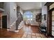 Open concept living room with floor to ceiling windows and a fireplace at 1159 Buffalo Ridge Rd, Castle Pines, CO 80108