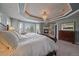 Bright main bedroom with fireplace and tray ceiling at 1159 Buffalo Ridge Rd, Castle Pines, CO 80108