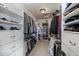 Organized walk-in closet with shelving and hanging space at 1159 Buffalo Ridge Rd, Castle Pines, CO 80108