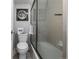 Shower, toilet, and moon-themed decor in updated bathroom at 1196 N Grant St # 204, Denver, CO 80203