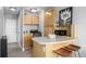 Studio apartment kitchen with light wood cabinets and stainless steel appliances at 1196 N Grant St # 204, Denver, CO 80203