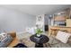 Studio apartment features an open floor plan with a mustard couch and kitchenette at 1196 N Grant St # 204, Denver, CO 80203