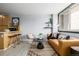 Bright living room with stylish mustard couch and large window at 1196 N Grant St # 204, Denver, CO 80203