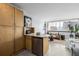 Open floor plan studio with kitchen island and living area at 1196 N Grant St # 204, Denver, CO 80203