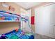 View of a bedroom with bunk beds, closet and neutral walls with carpeted floor at 23584 E 5Th Pl, Aurora, CO 80018