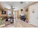 A spacious living area featuring a large sectional couch and light wood floors at 23584 E 5Th Pl, Aurora, CO 80018