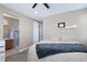 Bedroom featuring an ensuite bathroom and walk-in shower, with a carpeted floor at 23584 E 5Th Pl, Aurora, CO 80018