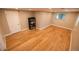 Bright basement featuring hardwood floors, natural light, and ample space at 2592 S Winona Ct, Denver, CO 80219