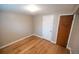 Finished basement with hardwood floors and neutral walls at 2592 S Winona Ct, Denver, CO 80219