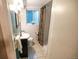 Bathroom showcases a shower, toilet, and wall decor at 2592 S Winona Ct, Denver, CO 80219