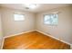 Bedroom showcasing hardwood floors and natural light at 2592 S Winona Ct, Denver, CO 80219