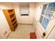 Mudroom featuring tile floors, natural light, and storage at 2592 S Winona Ct, Denver, CO 80219
