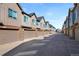 Row of newly built townhouse exteriors with two-car garages at 558 E Dry Creek Pl, Littleton, CO 80122